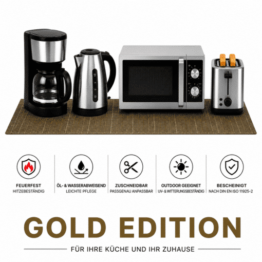 Moderne Küchengeräte wie Kaffeemaschine, Wasserkocher, Mikrowelle und Toaster auf einer Unterlage